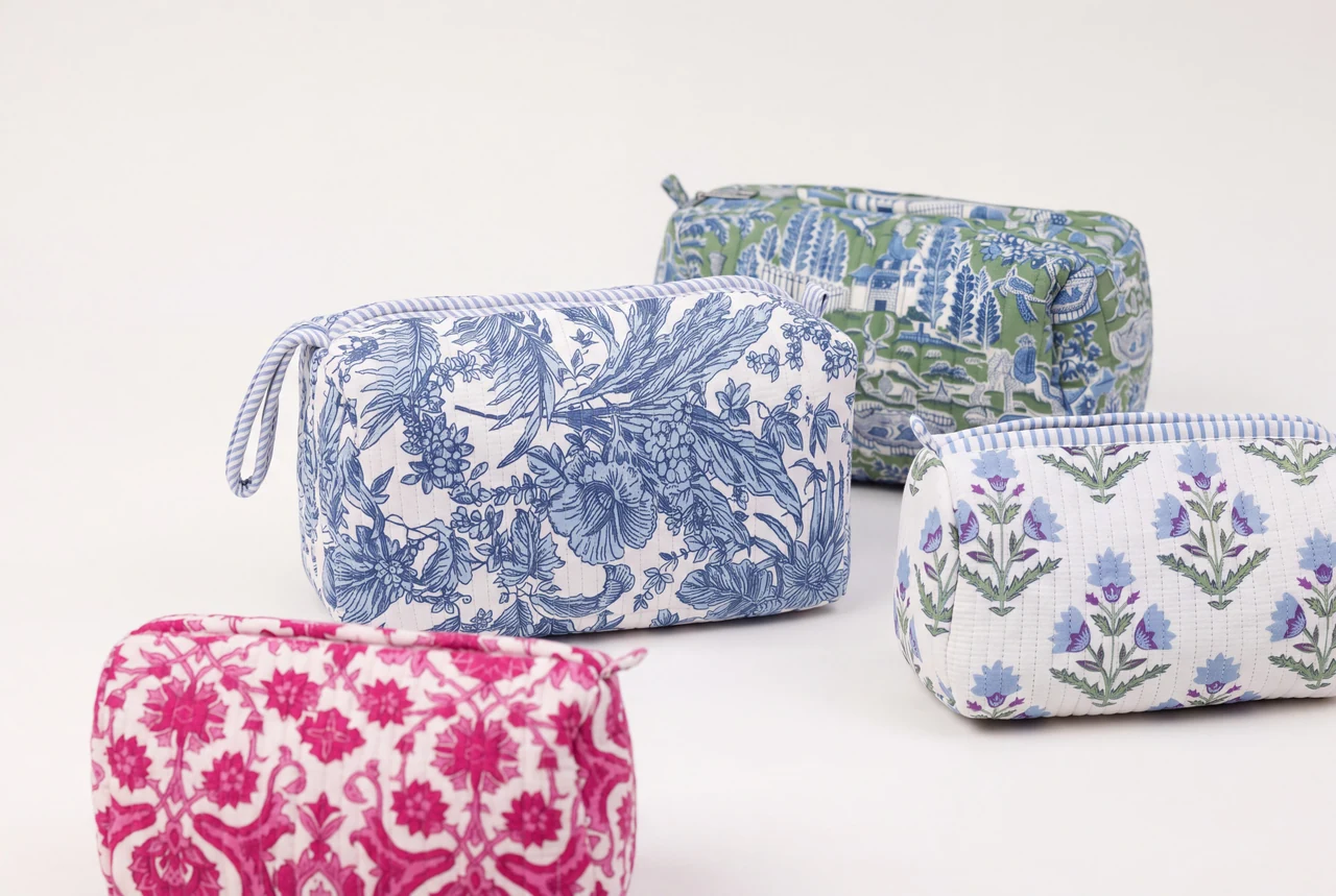 Four block-printed quilted Farylina toiletry bags in blue, green and pink prints